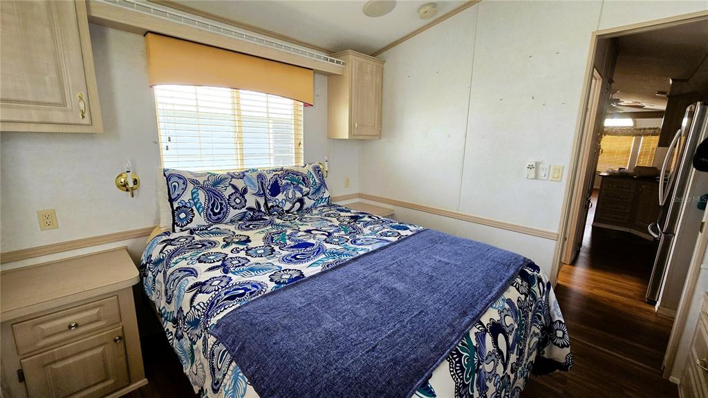 1317 Trout Punta Gorda, FL 33950 - Photo 19 of 55 a bed sitting in a bedroom next to a window