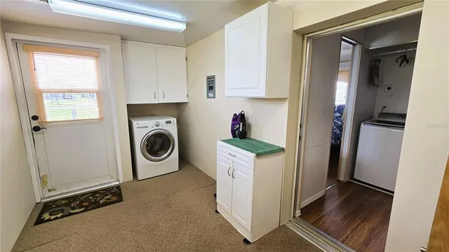 a view of swimming pool with seating space