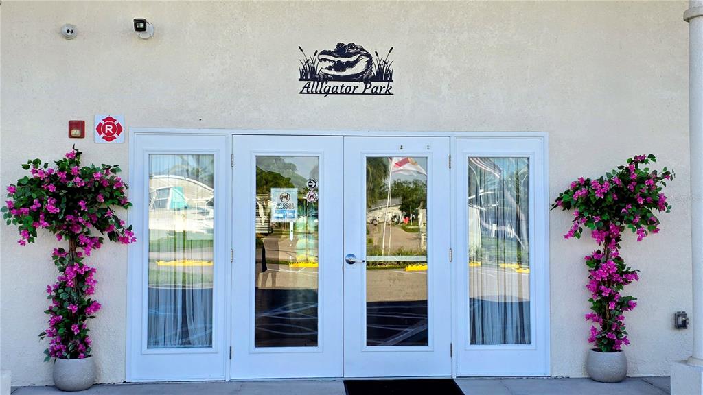 1317 Trout Punta Gorda, FL 33950 - Photo 31 of 55 a vase of flowers sitting on a floor in front of a window