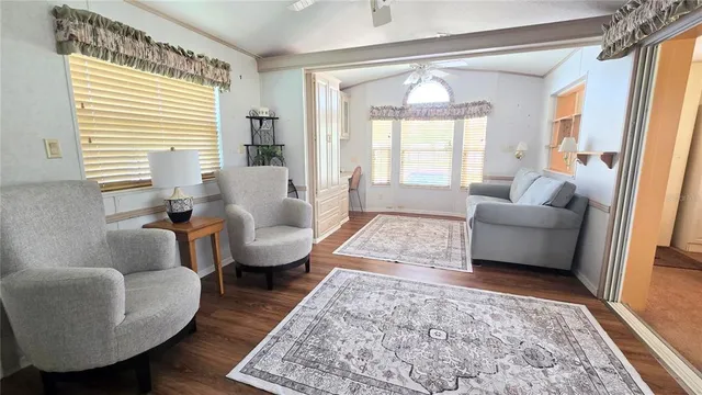 a kitchen with a sink cabinets and dining table