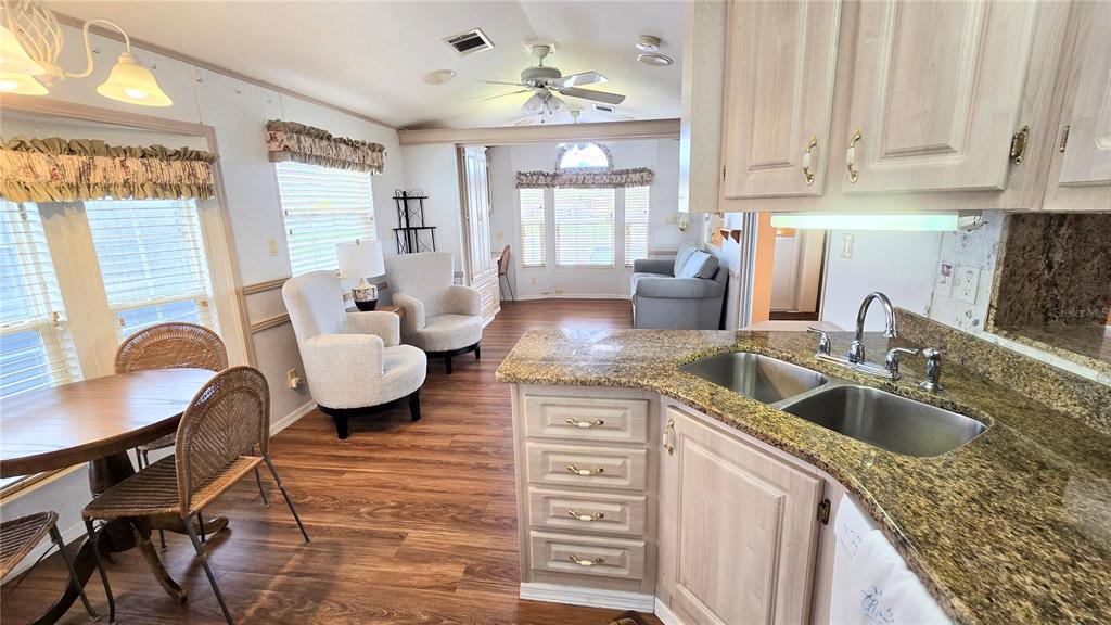 1317 Trout Punta Gorda, FL 33950 - Photo 7 of 55 a kitchen with a sink cabinets and dining table