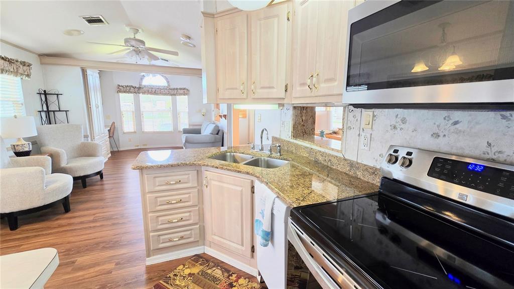 1317 Trout Punta Gorda, FL 33950 - Photo 9 of 55 a kitchen with stove and cabinets