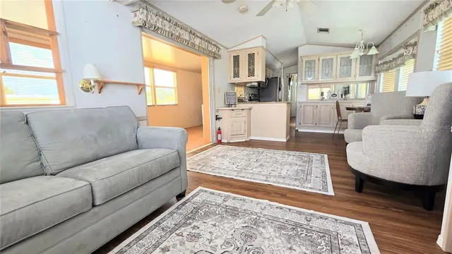 a living room with furniture and a rug