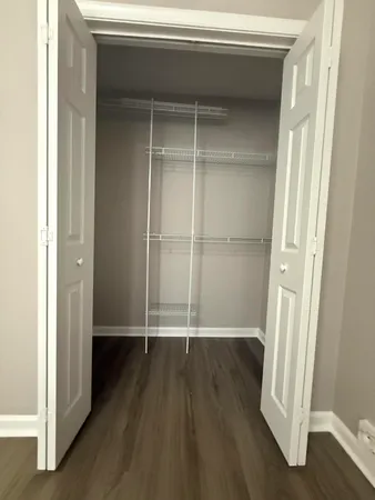 a view of wooden floor with entryway