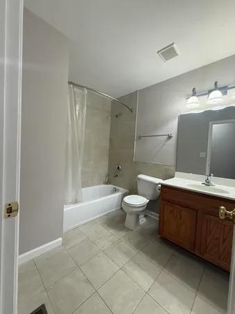 a bathroom with a bathtub toilet and sink