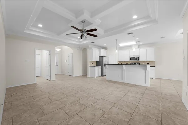 a view of a kitchen with a sink and cabinets