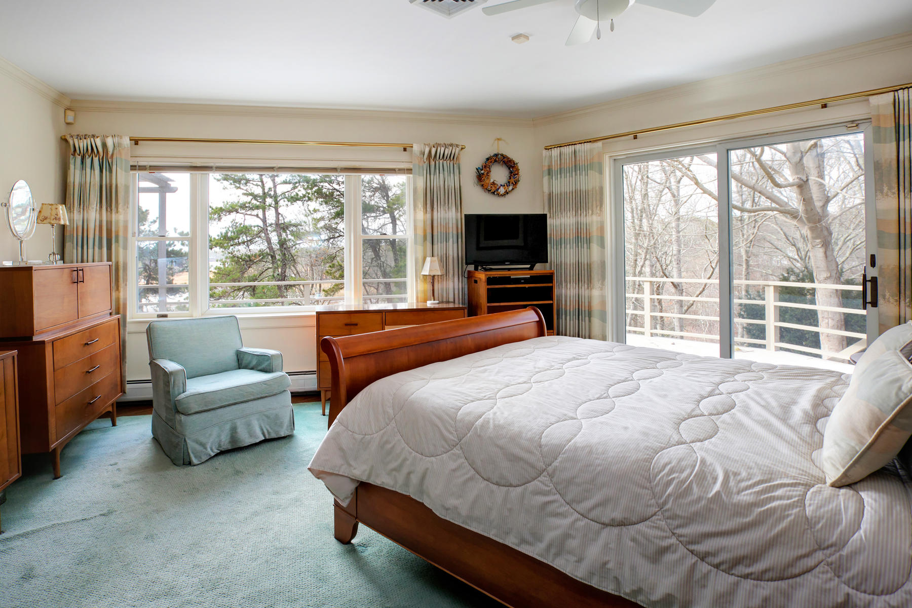 1855 South County Road Osterville, MA 02655 - Photo 11 of 26 a bedroom with a bed couch and large window
