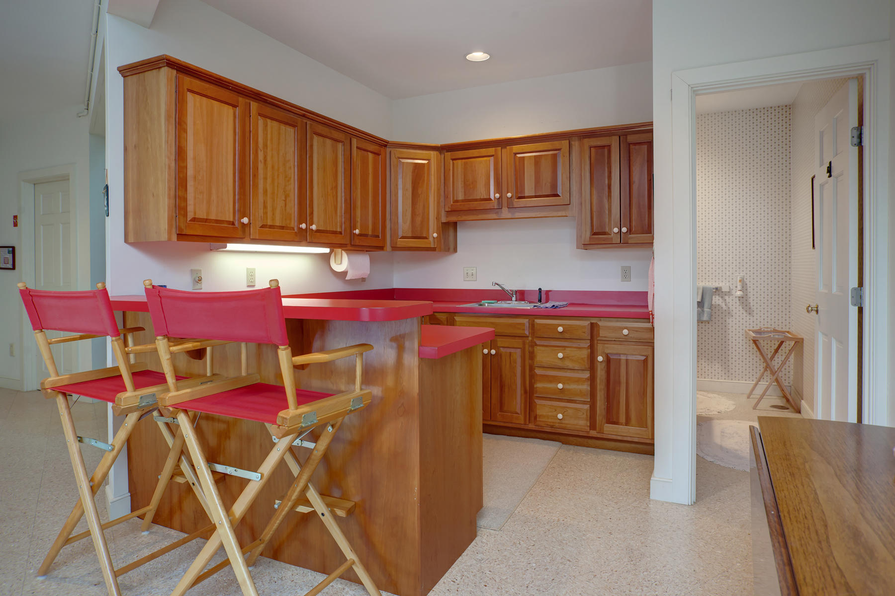 1855 South County Road Osterville, MA 02655 - Photo 18 of 26 a kitchen with stainless steel appliances granite countertop a sink and cabinets