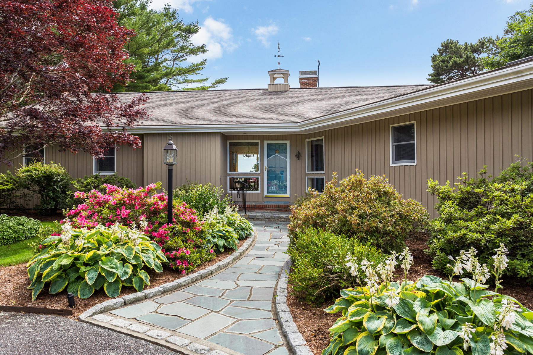 1855 South County Road Osterville, MA 02655 - Photo 5 of 26 a front view of house with flowers