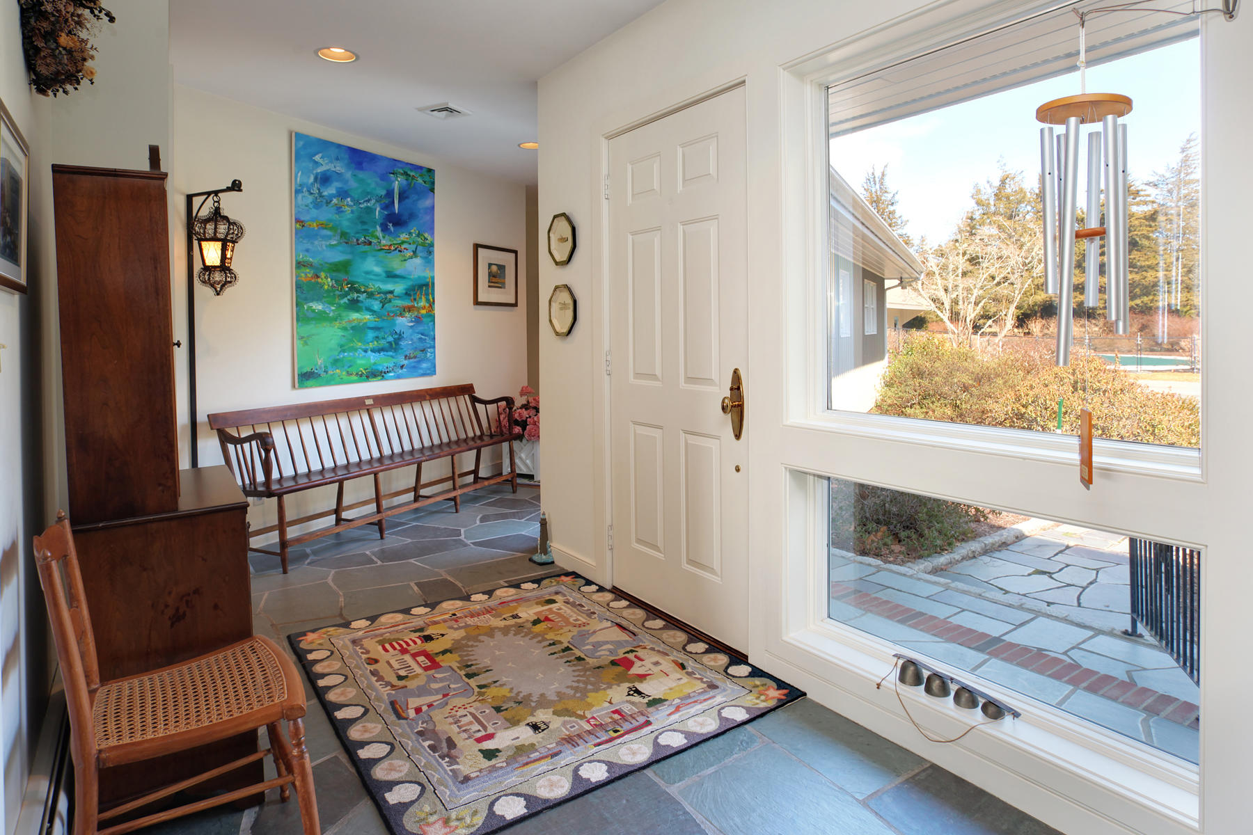 1855 South County Road Osterville, MA 02655 - Photo 7 of 26 a living room with furniture and a table
