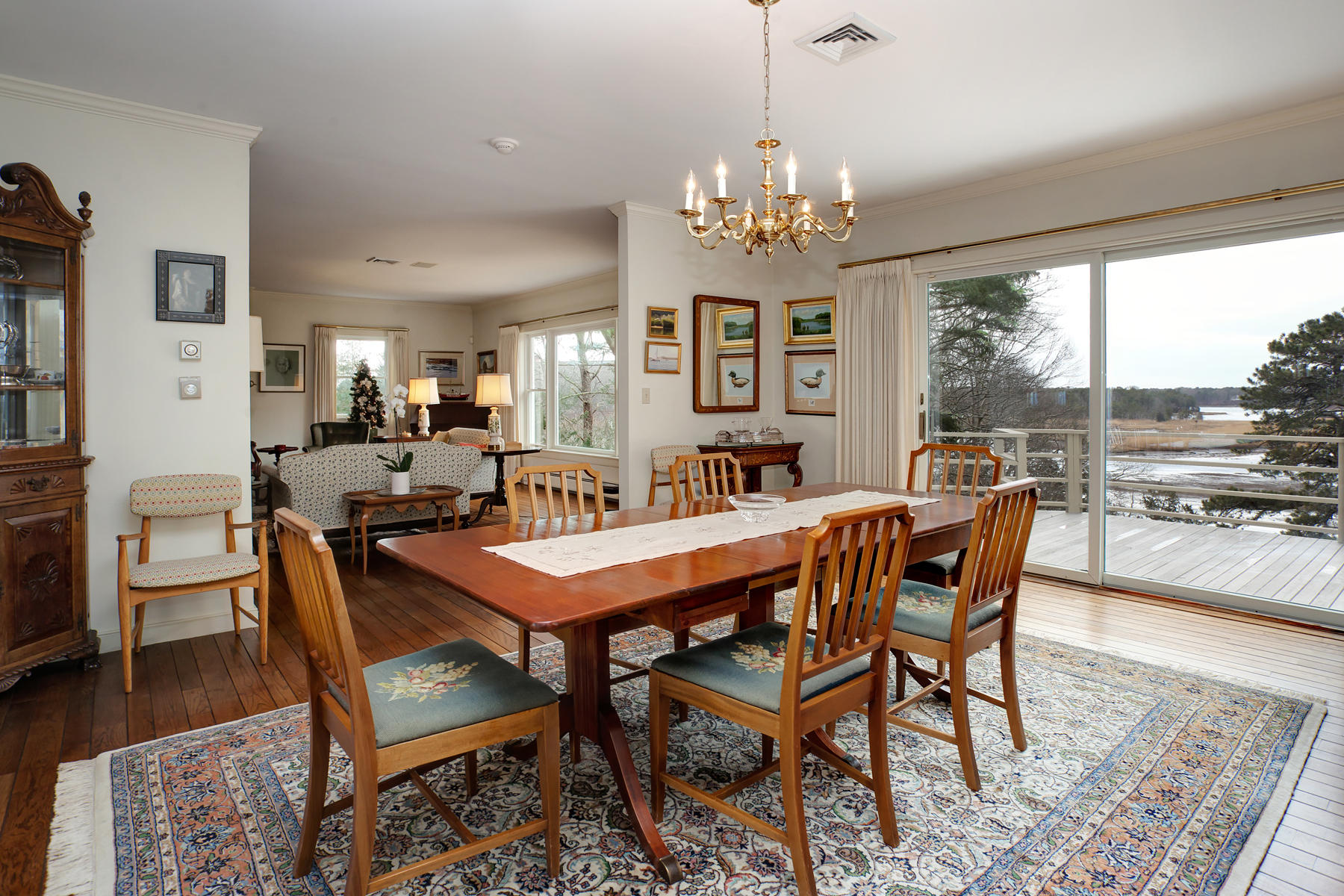 1855 South County Road Osterville, MA 02655 - Photo 8 of 26 a view of a dining room with furniture window and wooden floor