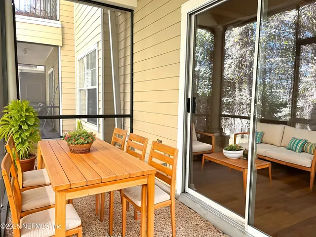 a dining room with table and chairs