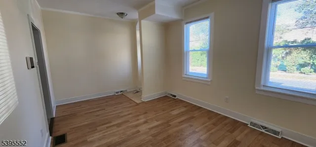 a kitchen with a refrigerator and a sink