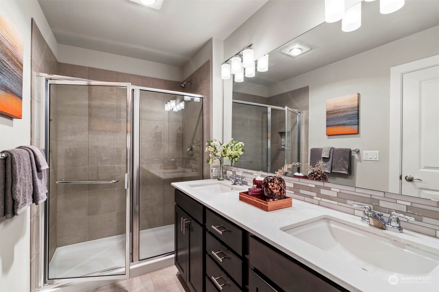 1621 Seattle Hill Road, Unit D3 Bothell, WA 98012 - Photo 13 of 25 a bathroom with a double vanity sink mirror and shower