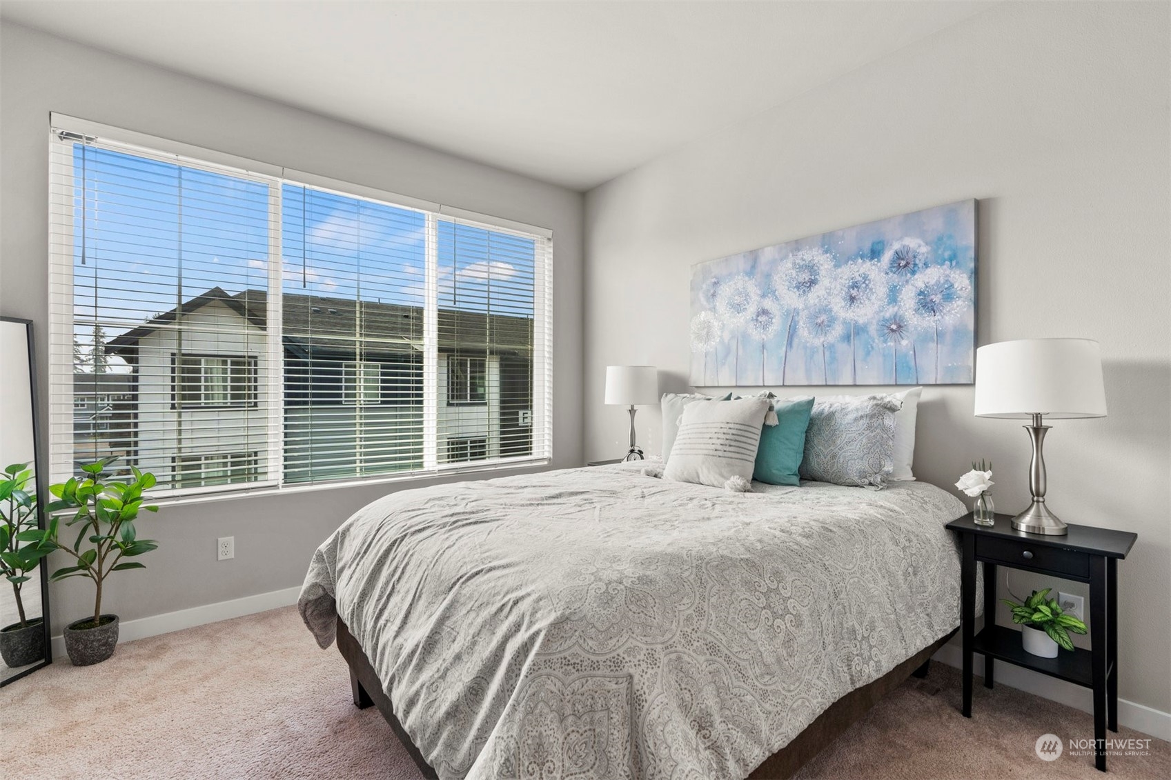 1621 Seattle Hill Road, Unit D3 Bothell, WA 98012 - Photo 15 of 25 a bedroom with a large bed and a potted plant