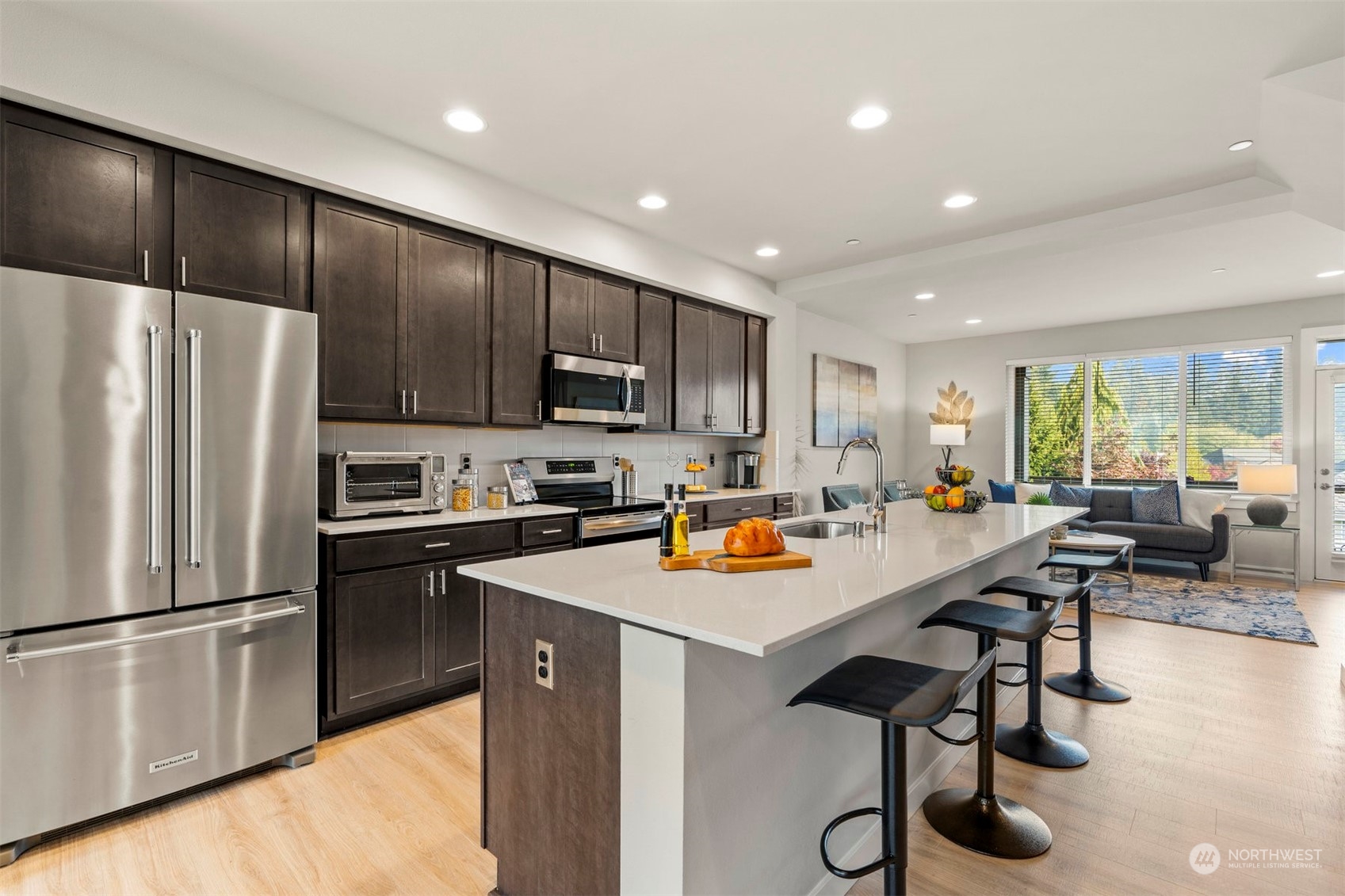 1621 Seattle Hill Road, Unit D3 Bothell, WA 98012 - Photo 2 of 25 a kitchen with stainless steel appliances a refrigerator sink and cabinets