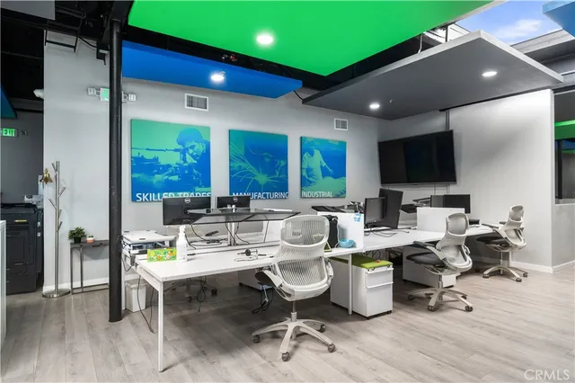 a living room with lots of furniture and a flat screen tv