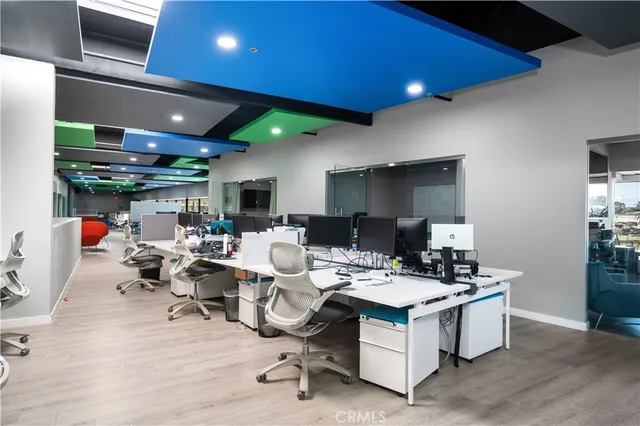 a view of a room with gym equipment and a large window