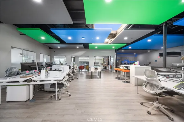 a large room with lots of table and chairs