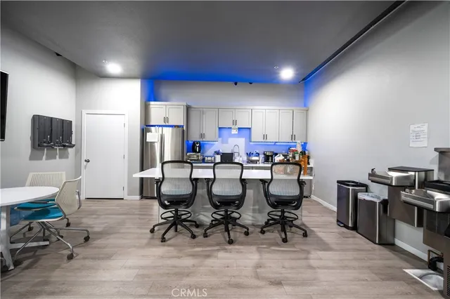 a kitchen with stainless steel appliances a refrigerator and a sink