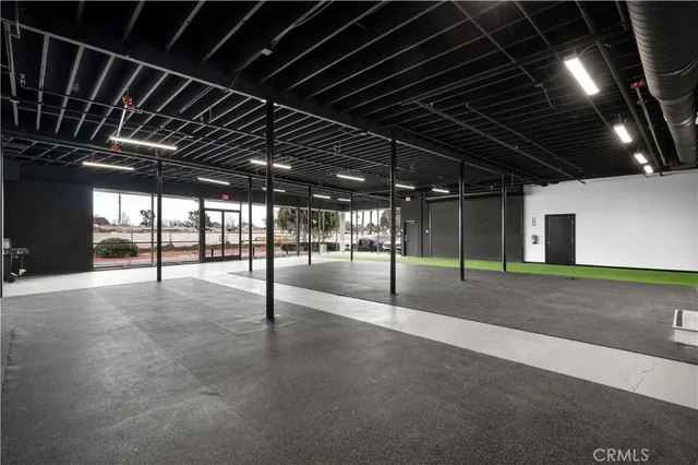 a view of an empty room with a fireplace