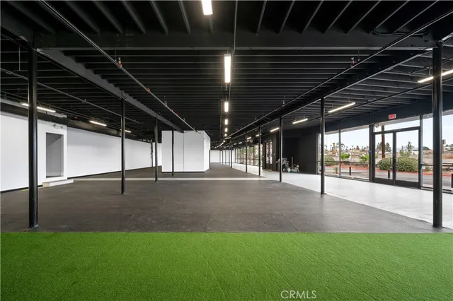a view of a street with a building in the background