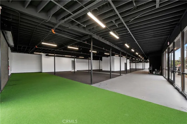 a view of a street with a building in the background