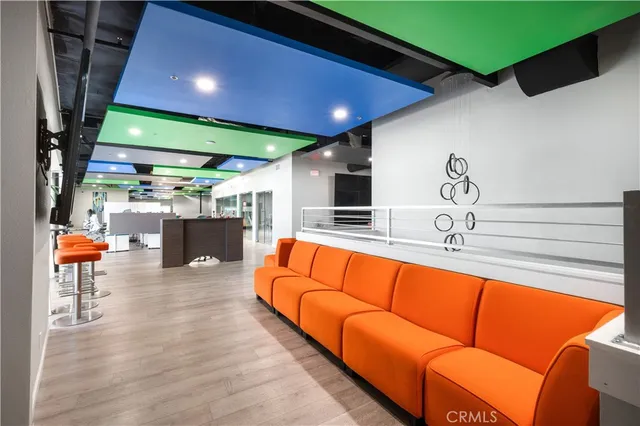 a living room with fireplace furniture and a flat screen tv