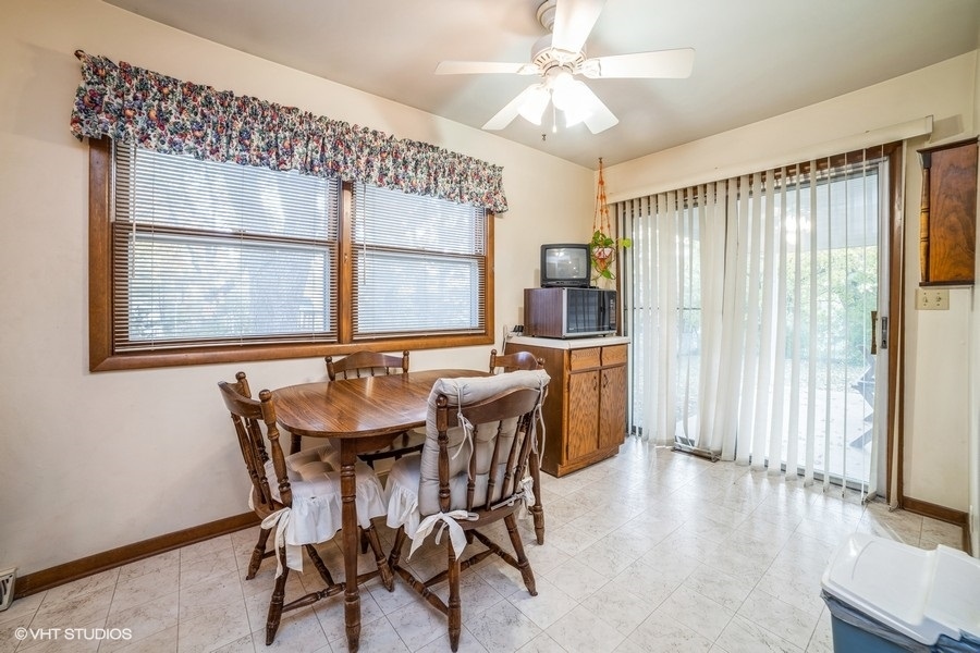 1208 Ridgeway Drive Elgin, IL 60123 - Photo 5 of 10 a view of a dining room with furniture and window