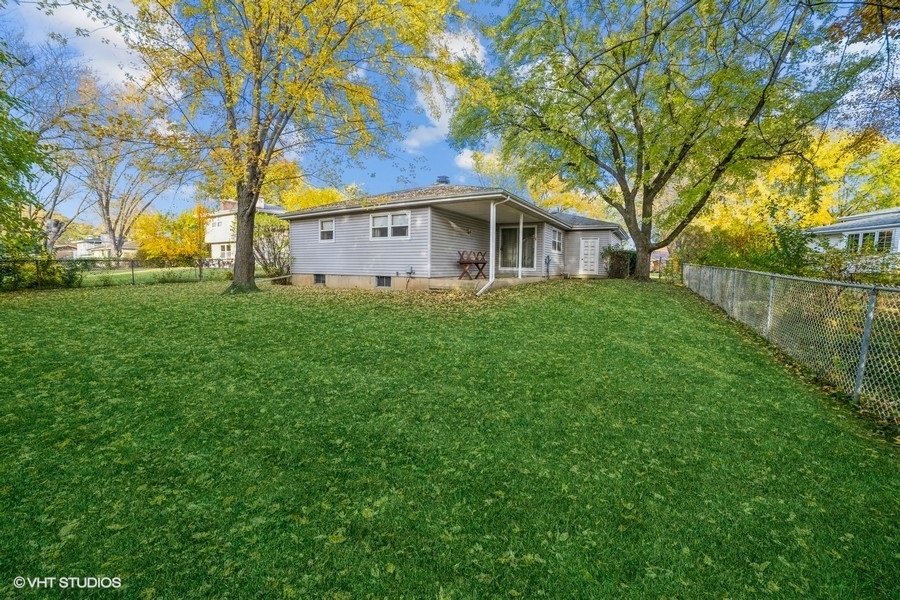 1208 Ridgeway Drive Elgin, IL 60123 - Photo 10 of 10 a front view of a house with yard and tree