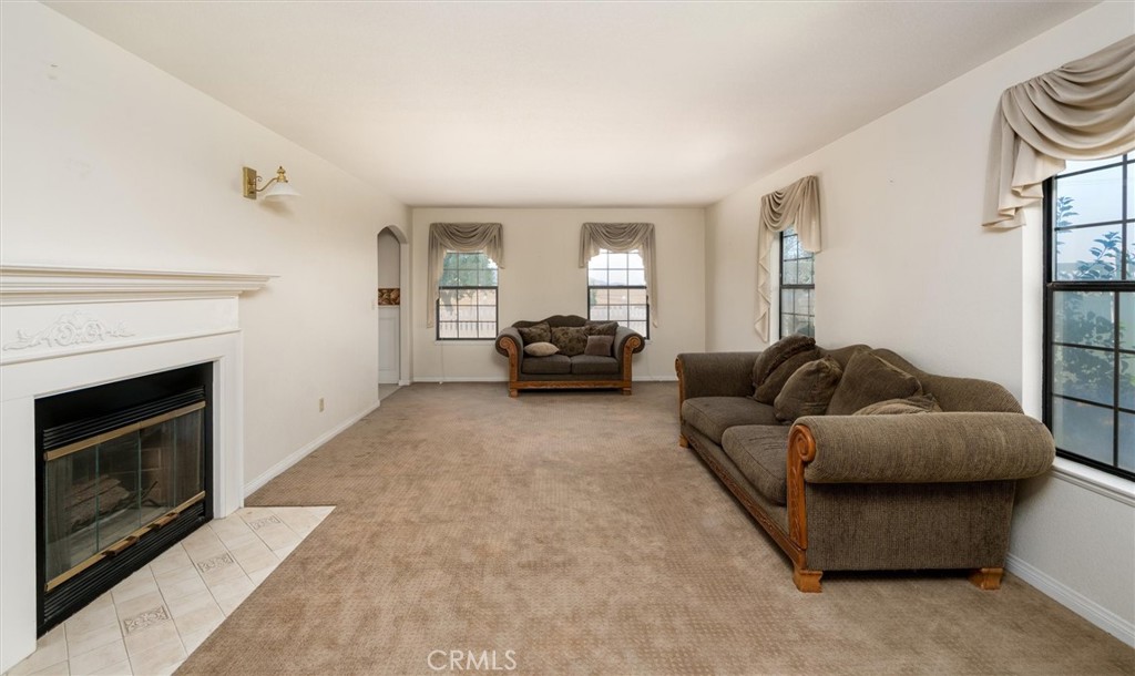 34150 Stowe Road Winchester, CA 92545 - Photo 22 of 80 a living room with furniture a fireplace and a window