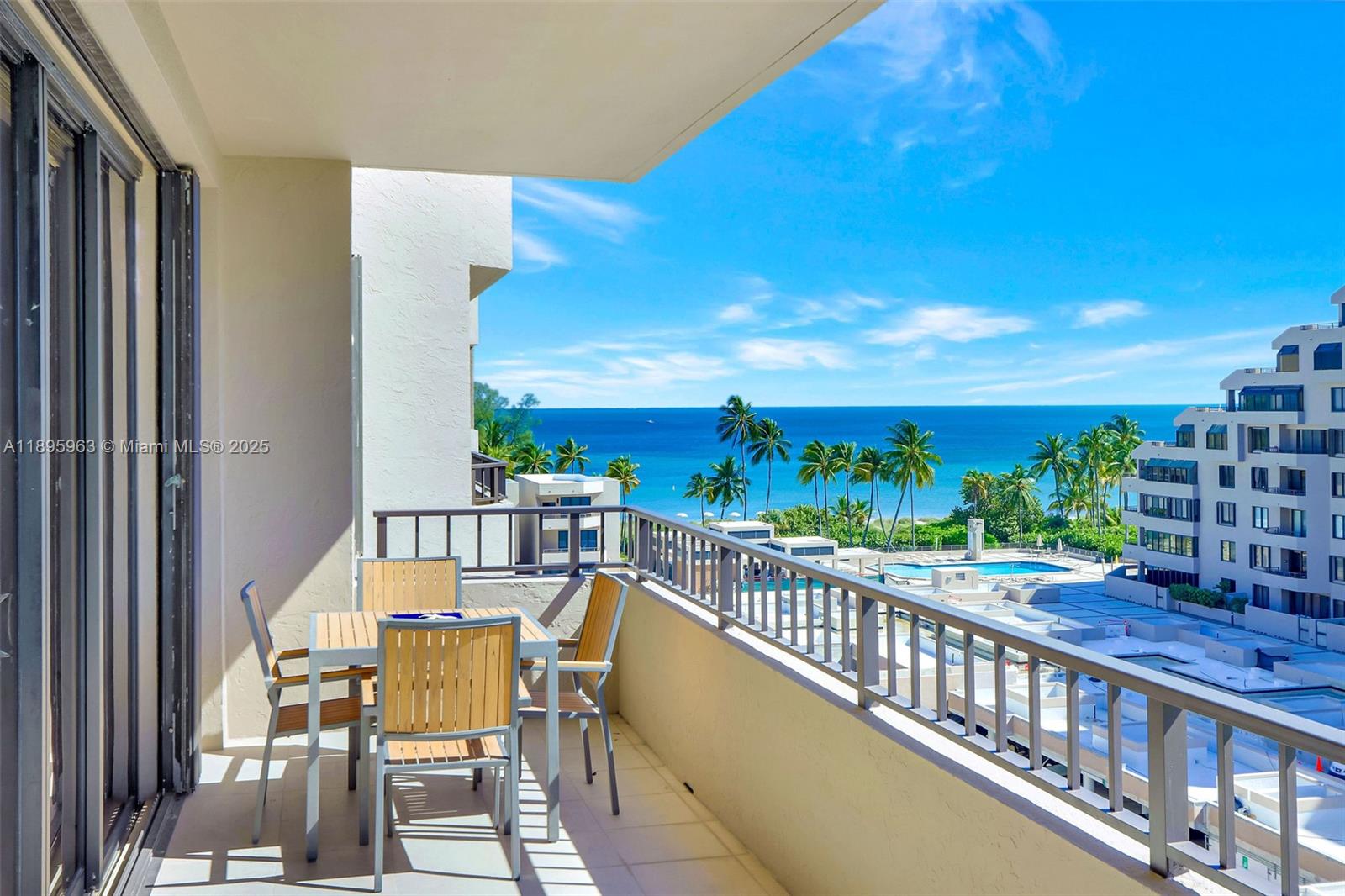 251 Crandon Boulevard, Unit 628 Key Biscayne, FL 33149 - Photo 11 of 32 a view of a balcony with chairs
