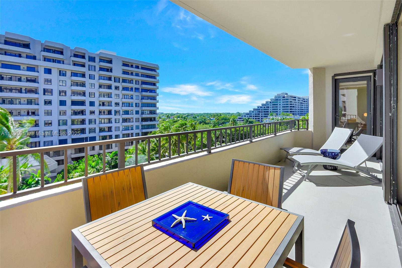 251 Crandon Boulevard, Unit 628 Key Biscayne, FL 33149 - Photo 13 of 32 a view of balcony with wooden floor and outdoor seating