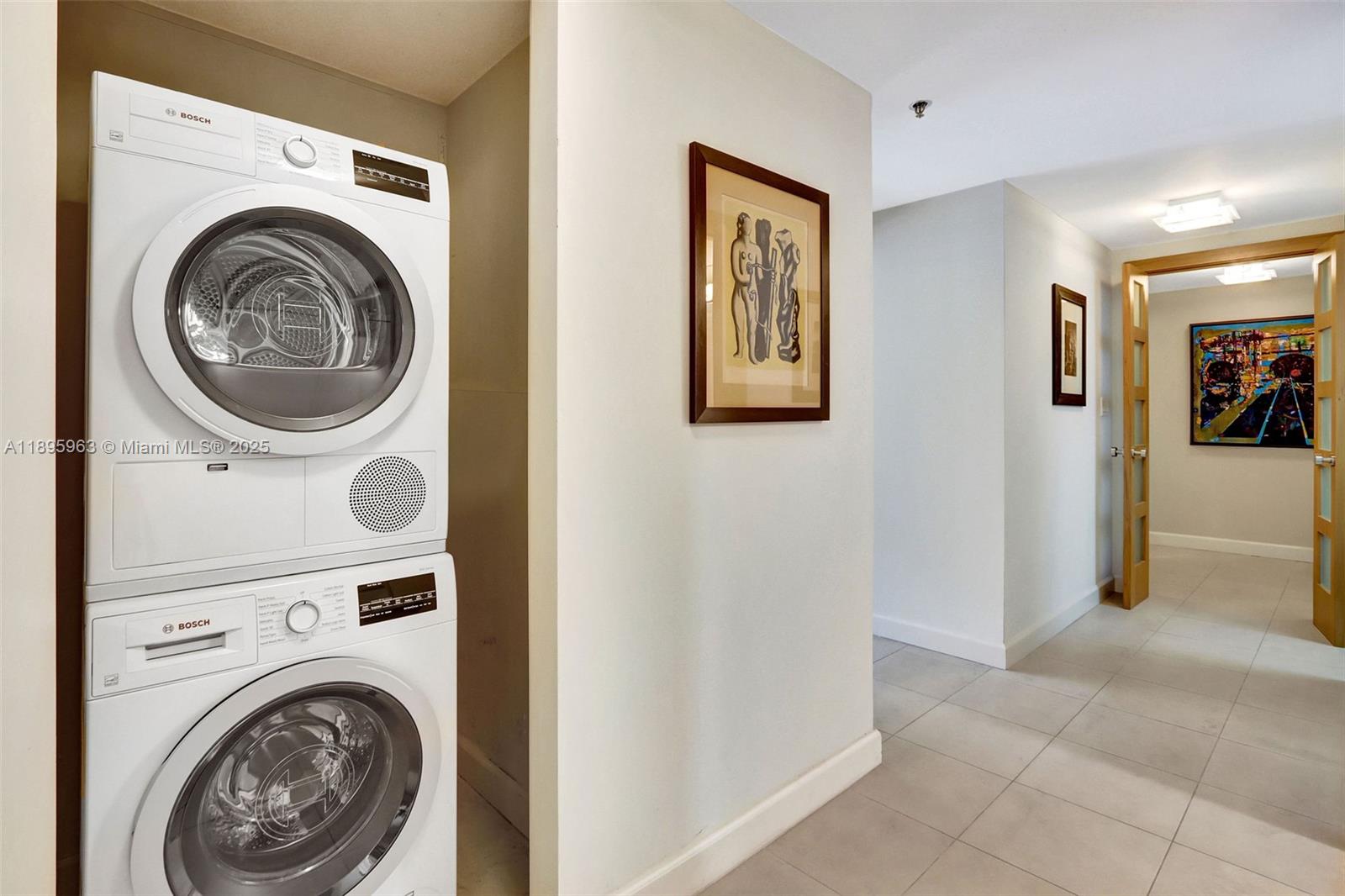 251 Crandon Boulevard, Unit 628 Key Biscayne, FL 33149 - Photo 14 of 32 a view of a hallway with washer and dryer