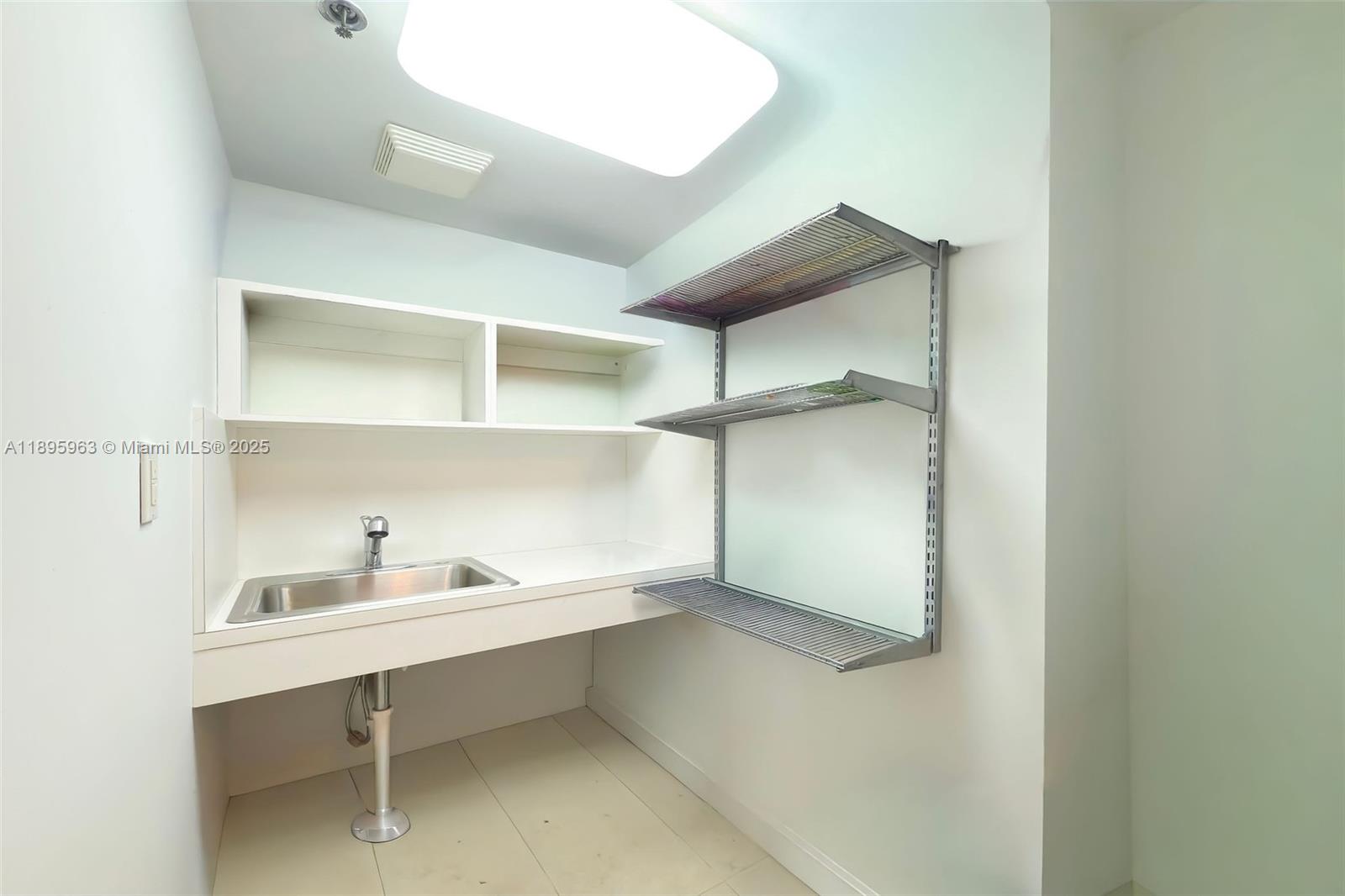 251 Crandon Boulevard, Unit 628 Key Biscayne, FL 33149 - Photo 15 of 32 a view of an empty walk in closet