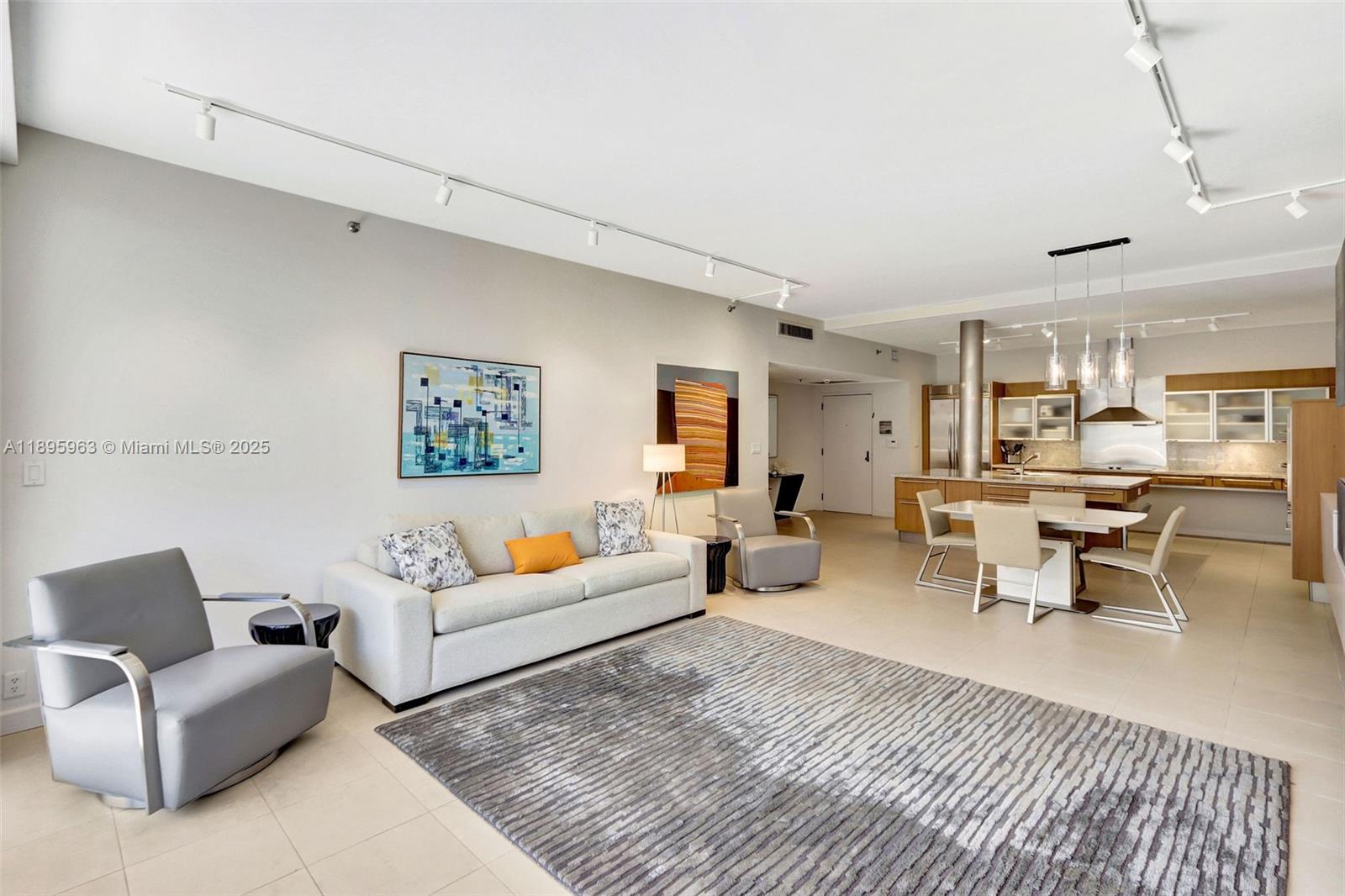 251 Crandon Boulevard, Unit 628 Key Biscayne, FL 33149 - Photo 4 of 32 a living room with furniture and view of kitchen