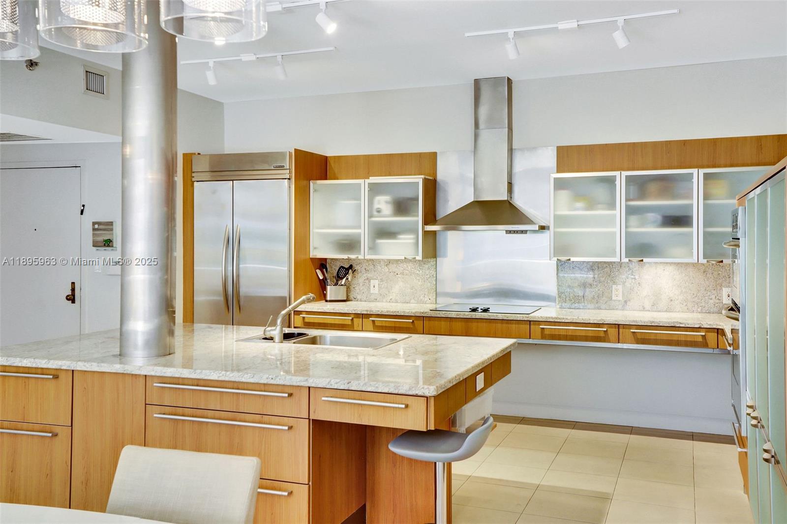 251 Crandon Boulevard, Unit 628 Key Biscayne, FL 33149 - Photo 8 of 32 a view of a kitchen with a sink and cabinets