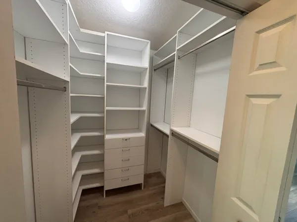 a view of a room with gym equipment and a window