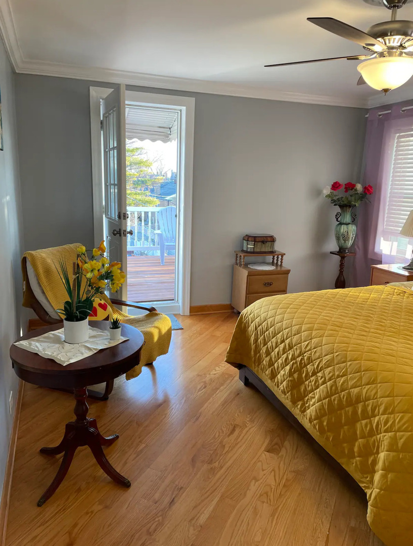 6101 West Fletcher Street, Unit 1 Chicago, IL 60634 - Photo 6 of 17 a bed sitting in a bedroom next to a window