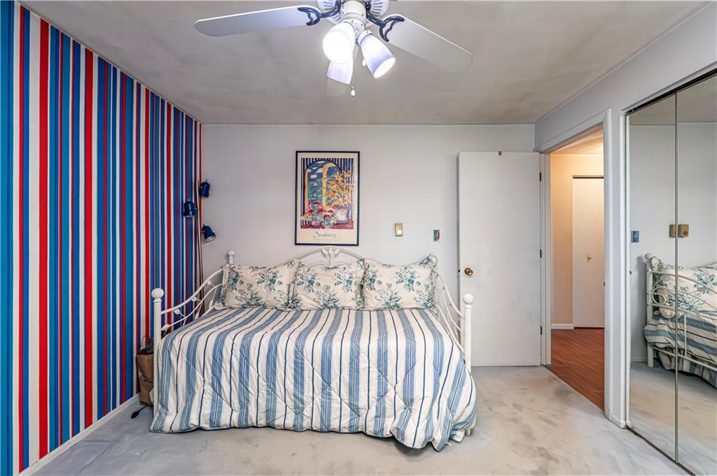 2037 Ridge Road Jeannette, PA 15644 - Photo 18 of 24 a bedroom with a large bed and a chandelier
