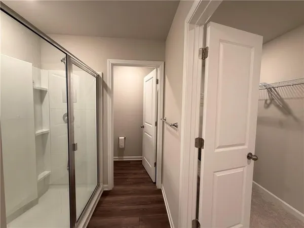 a view of a bathroom from a hallway