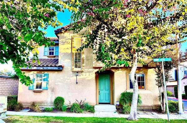 front view of a house with a tree