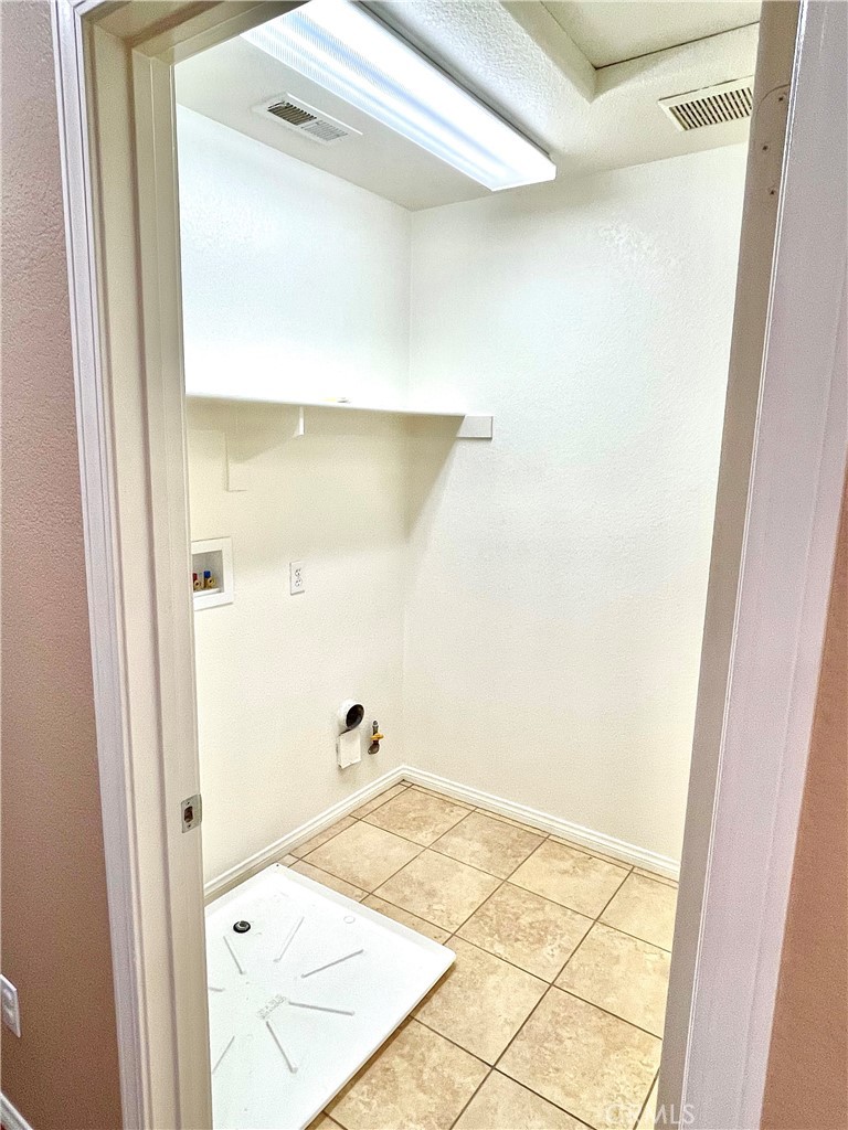 4473 Bigem Court Riverside, CA 92501 - Photo 11 of 18 a bathroom with a shower