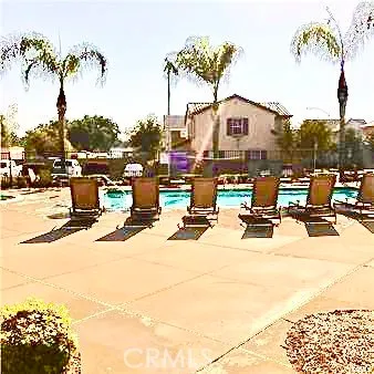 a view of a patio with a table and chairs