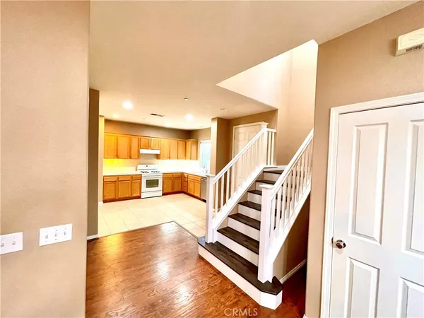 a view of entryway and kitchen