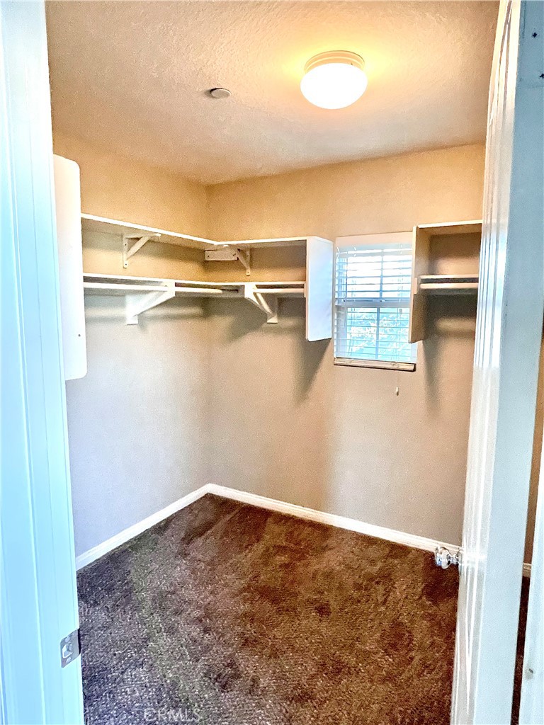 4473 Bigem Court Riverside, CA 92501 - Photo 9 of 18 a view of a room with rack on the wall and a window