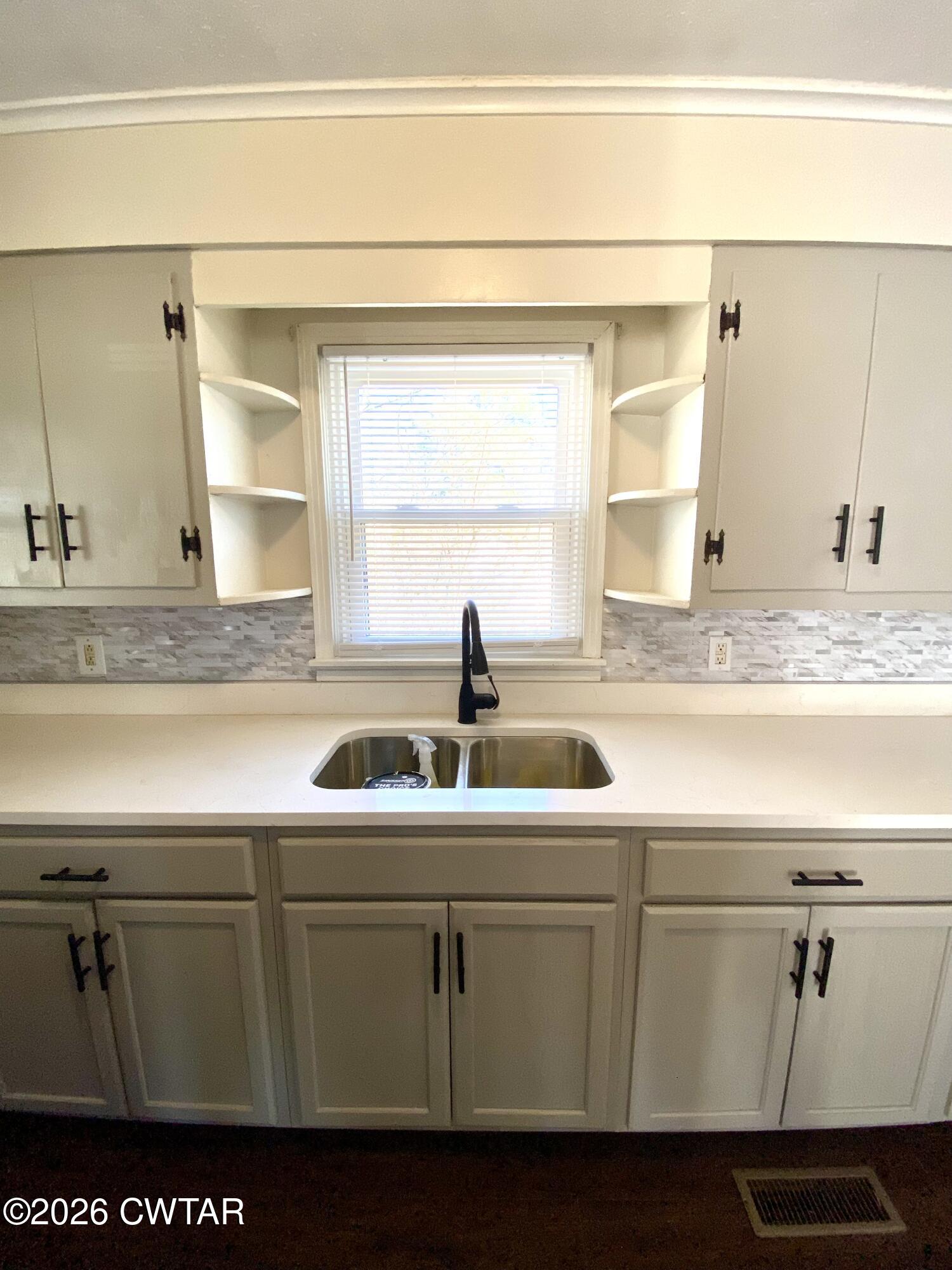 20 South Garland Street McKenzie, TN 38201 - Photo 3 of 18 a close view of sink and tap
