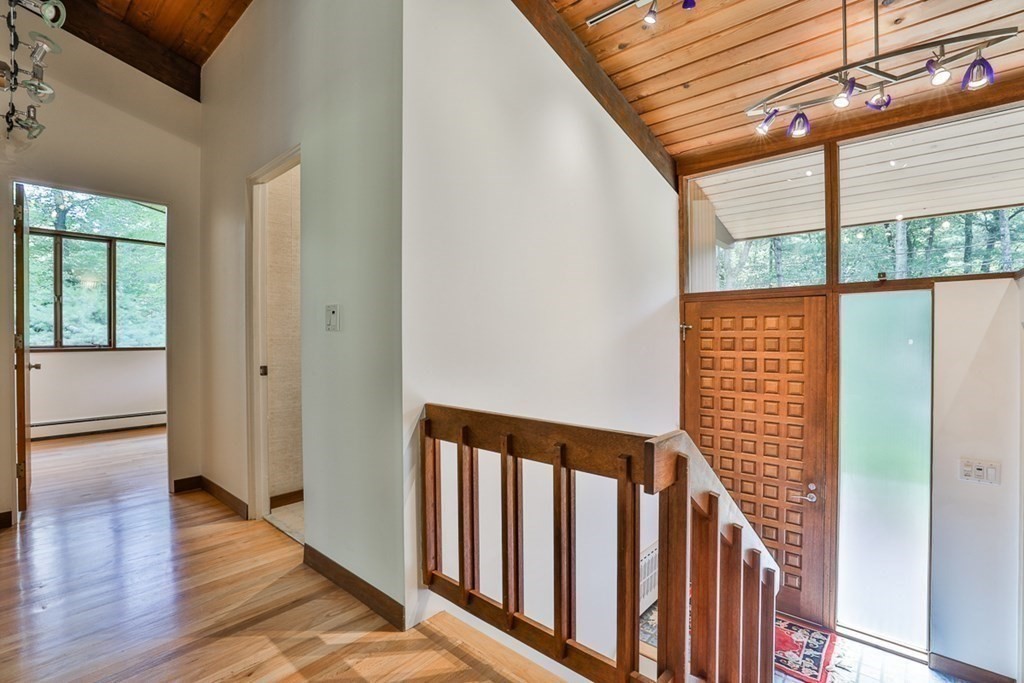 62 Woodside Road Harvard, MA 01451 - Photo 19 of 36 a view of a porch with wooden floor and stairs