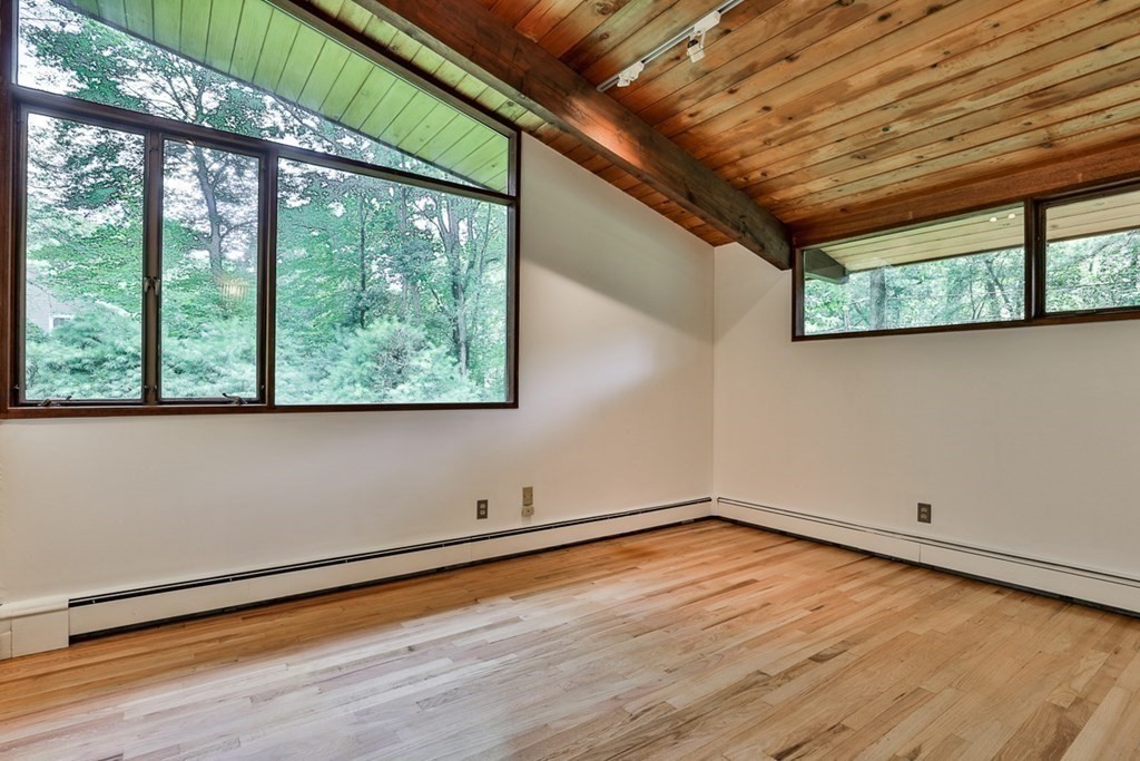 62 Woodside Road Harvard, MA 01451 - Photo 23 of 36 a view of room with window and wooden floor