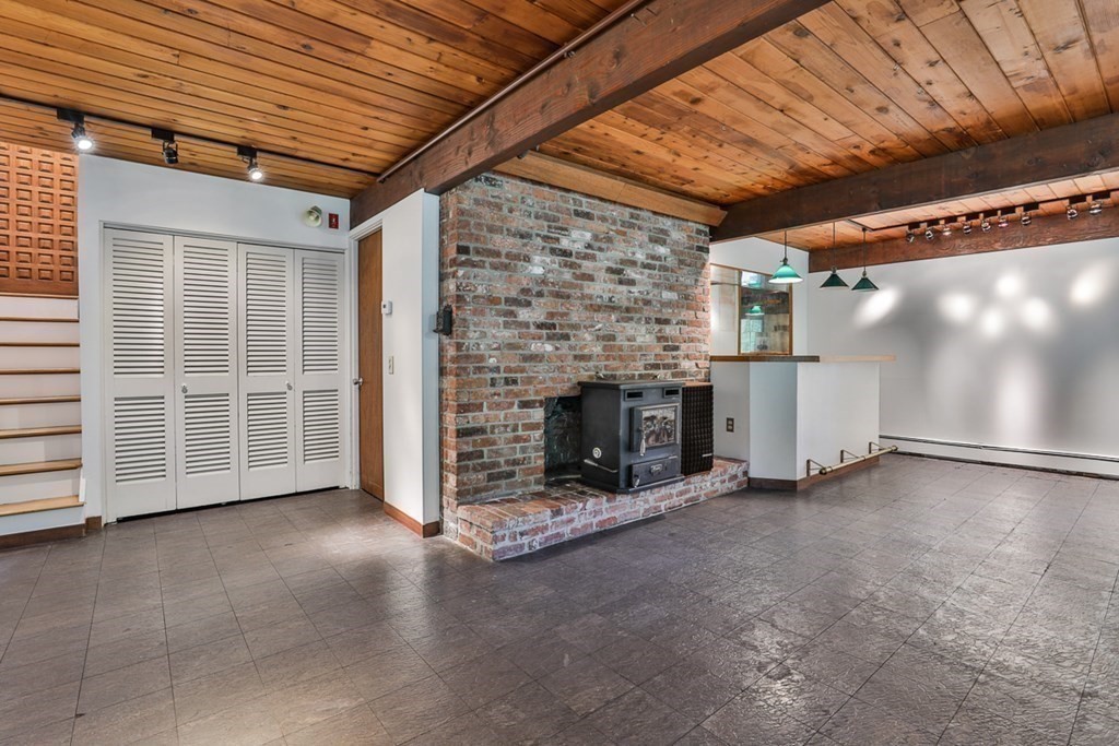 62 Woodside Road Harvard, MA 01451 - Photo 26 of 36 a view of empty room with a fireplace